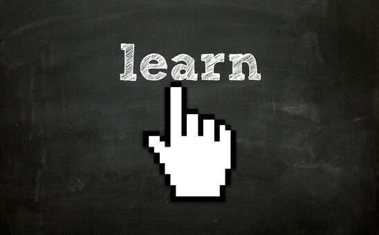 hand cursor clicking "learn" text on blackboard
