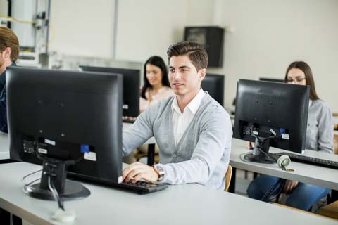 man-in-classroom-at-computer